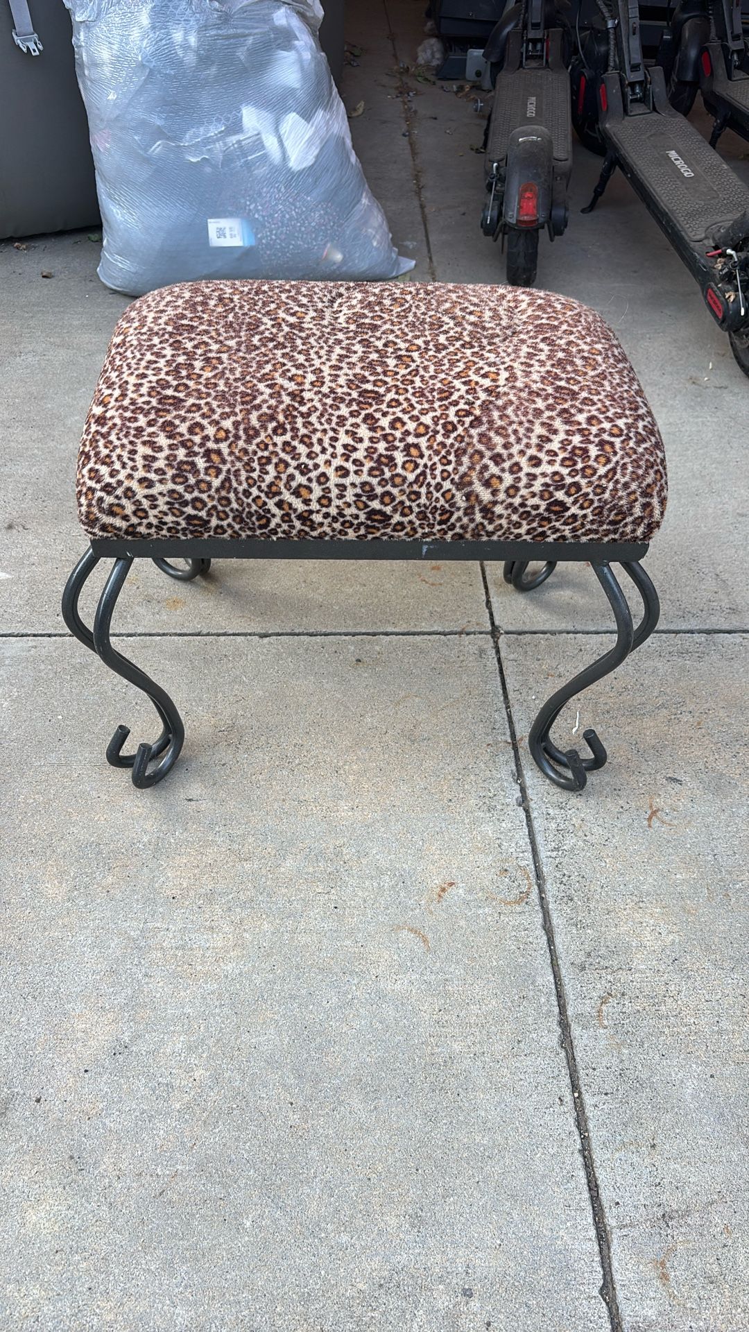 Cushioned animal print ottoman/footstool