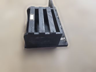 Black wooden wall-mount entryway organizer with mail slot and hooks