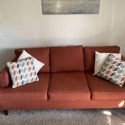 Beautiful, modern red couch with three seats