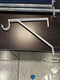 Closet rod supports and closet rods