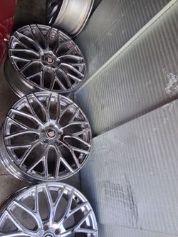 Twenty inch , vogue tires , along with 20 inch cadillac rims