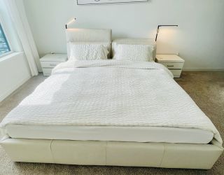 King size genuine leather bed, power adjustable head rest, built in lights with matching nightstands
