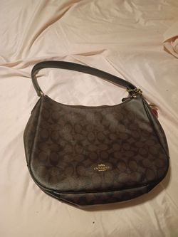 Emily Shoulder Bag
In Signature Canvas