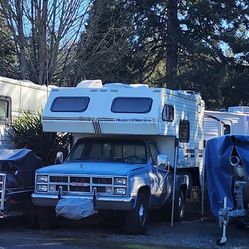 GMC 3/4ton pickup W/4 wheel Drive, 350 engine, electric winch and camper.