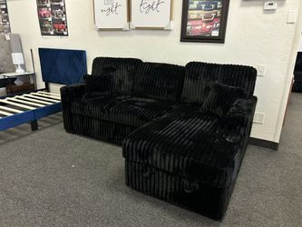 Sectional Sleeper With Storage And Cupholders 