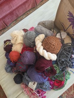 Looks like about 40 balls skeins of wool mostly knitting yarn