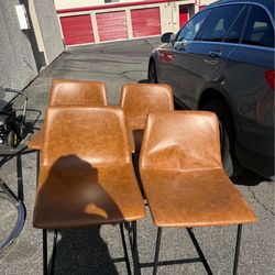 Brown real leather bar stools.