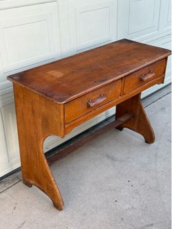 Solid wood vintage desk with two drawers.