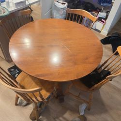 Light Brown ( wood) round table with 4 chairs