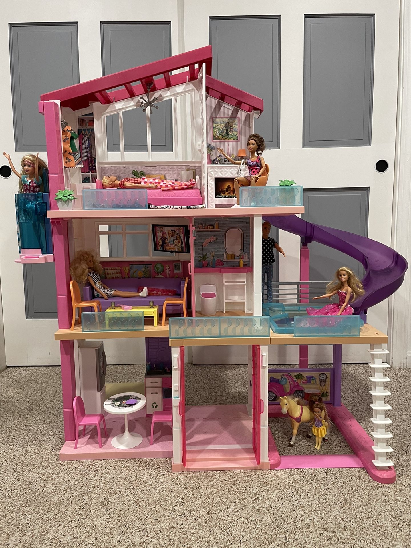 Barbie® DreamHouse™ Dollhouse with Pool, Slide and Elevator