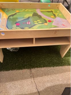 Wooden Kids playtable with storage.