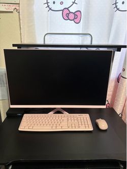 Pink Pixio monitor including PC, keyboard, mouse, and the desk.