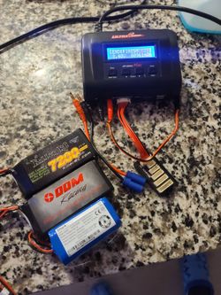 Ultra power plus charger and 2 brand new receiver batteries...ddm battery was 70new and  the killer rc battery 30...charger was 40 new
