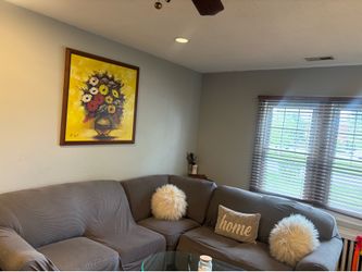 Gray sectional. Sofa and  Glass coffee Table