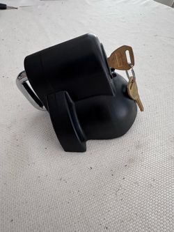This black Handway coupler lock is designed to secure trailer hitches with a durable powder-coated finish to resist https://offerup.com/redirect/?o=Y2