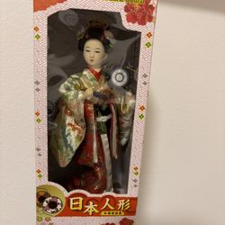Japanese Doll With A Musical Instrument