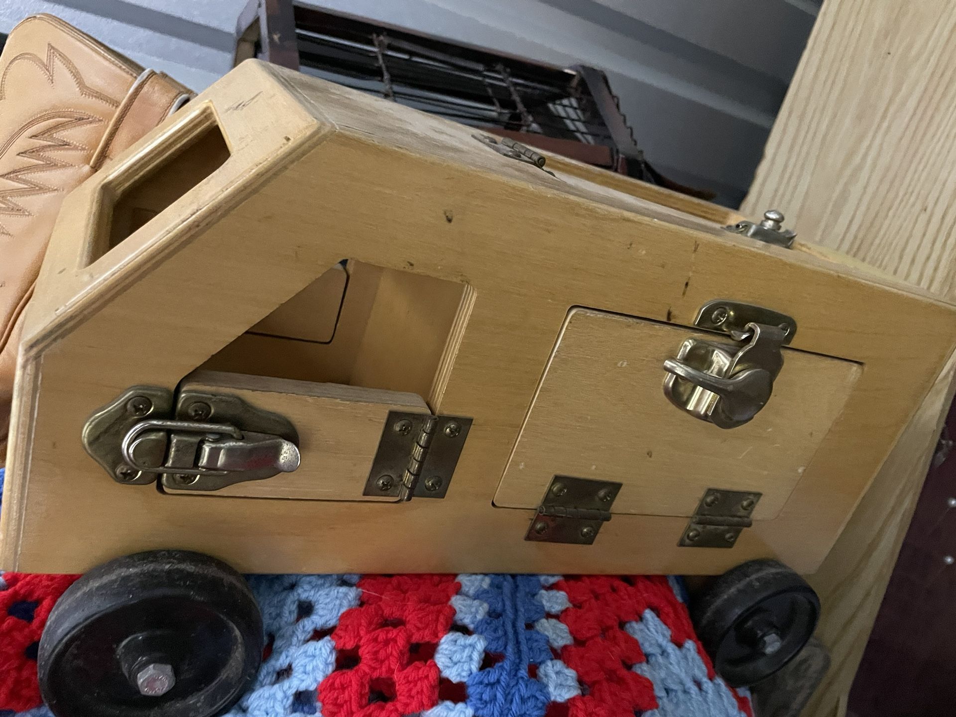 Toy Truck With Several Different Open And Close Latches To Teach Children