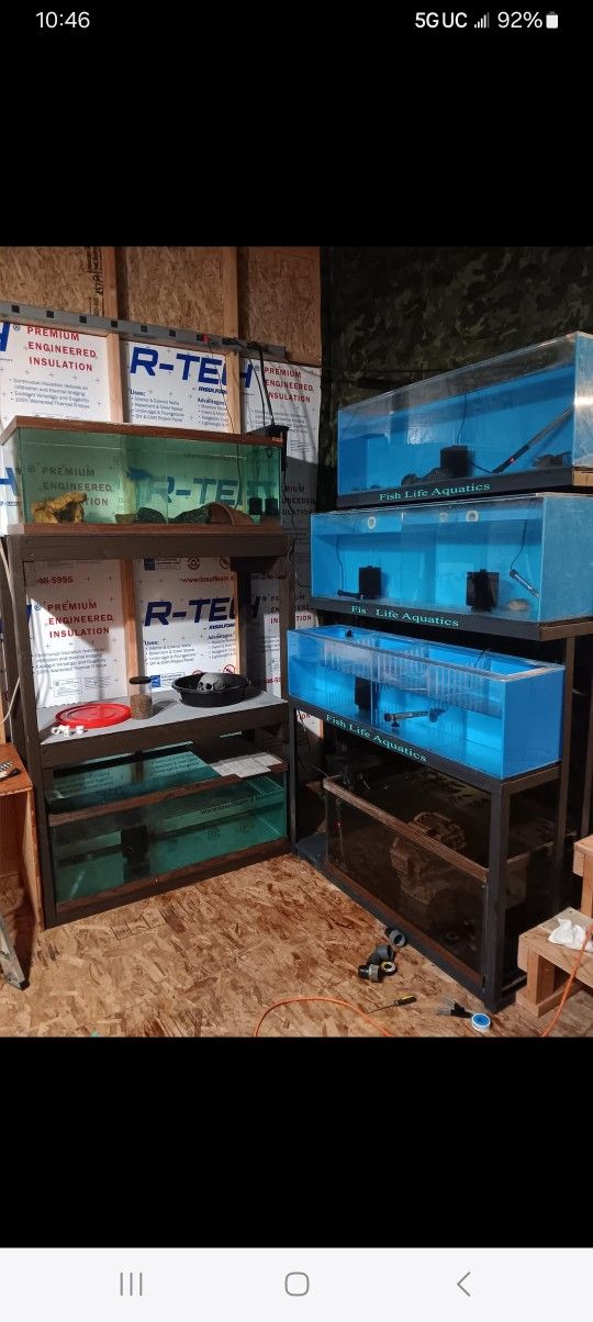 3 40 gallon acrylic. fish tanks and the metal wreck that they go on.
