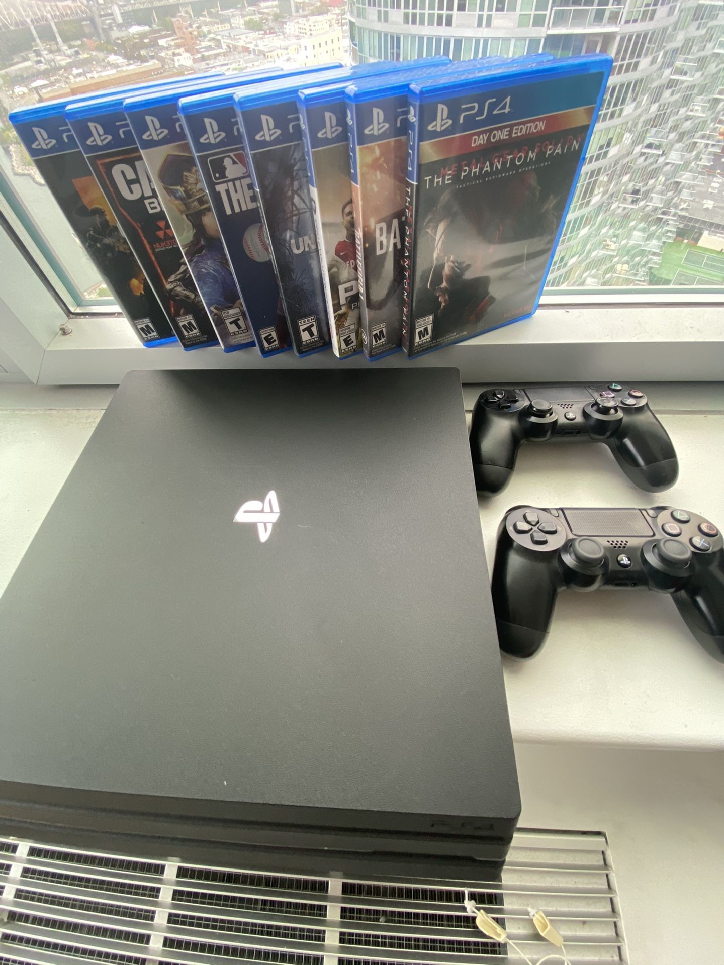 PS4 Pro 1TB with controllers and games ! Like new