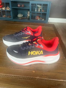 Hoka Sneakers Black and Blue with red Men 7D or women  size 8.