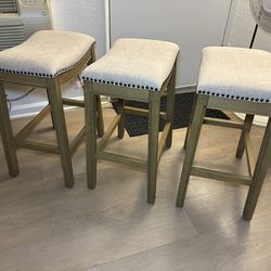 Adrien Saddle Bar Stool in Light Brown Finish and Natural Fabric