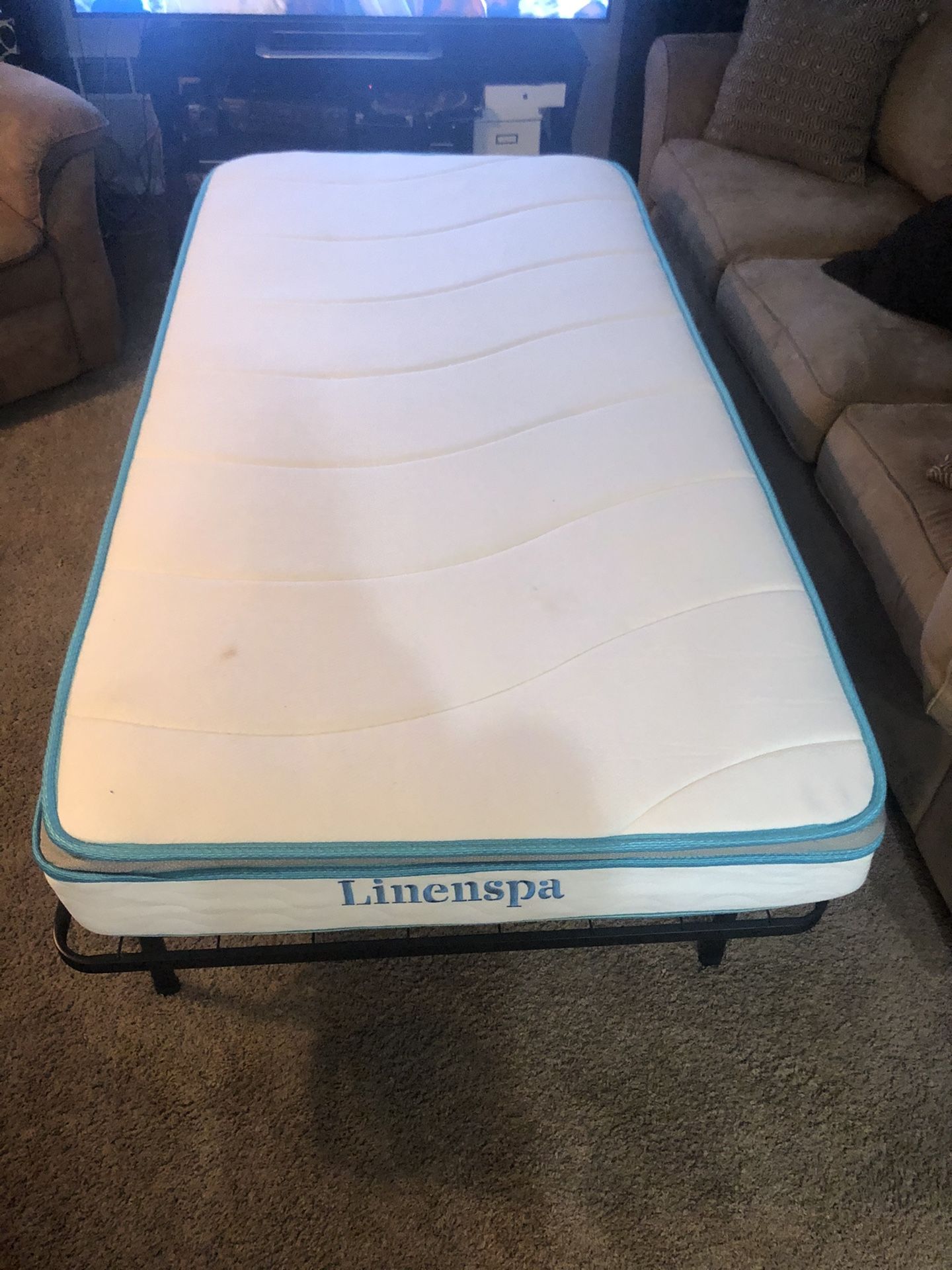 Twin sz Linenspa mattress with medal foldable twin sz frame also I’m throwing in a extra trim orthopedic mattress if anyone wants also