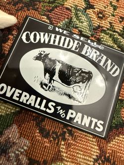 "Cowhide Brand Overalls and Pants," likely produced by Ande Rooney magnet