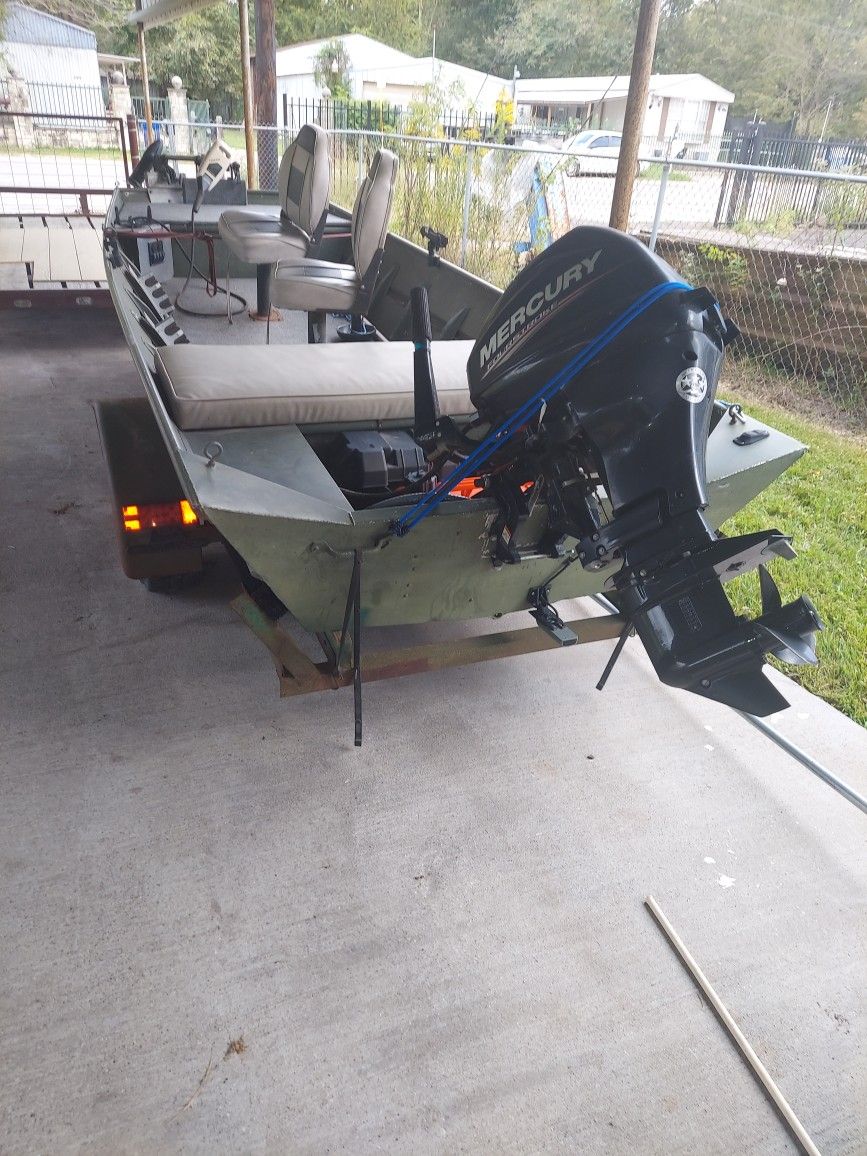 15 Ft. Alumacraft Jon Boat With A 20 HP Mercury 4 Stroke  Outboard Motor 