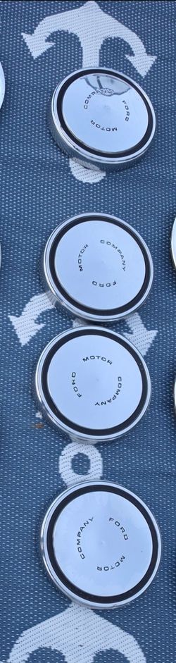 Original vintage Ford Motor Company center caps (dog dish hubcaps).