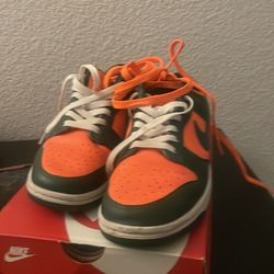 Nike dunks orange and green