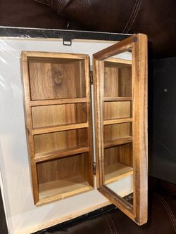 wooden storage box with an integrated mirror lid and a pull-out bottom drawer