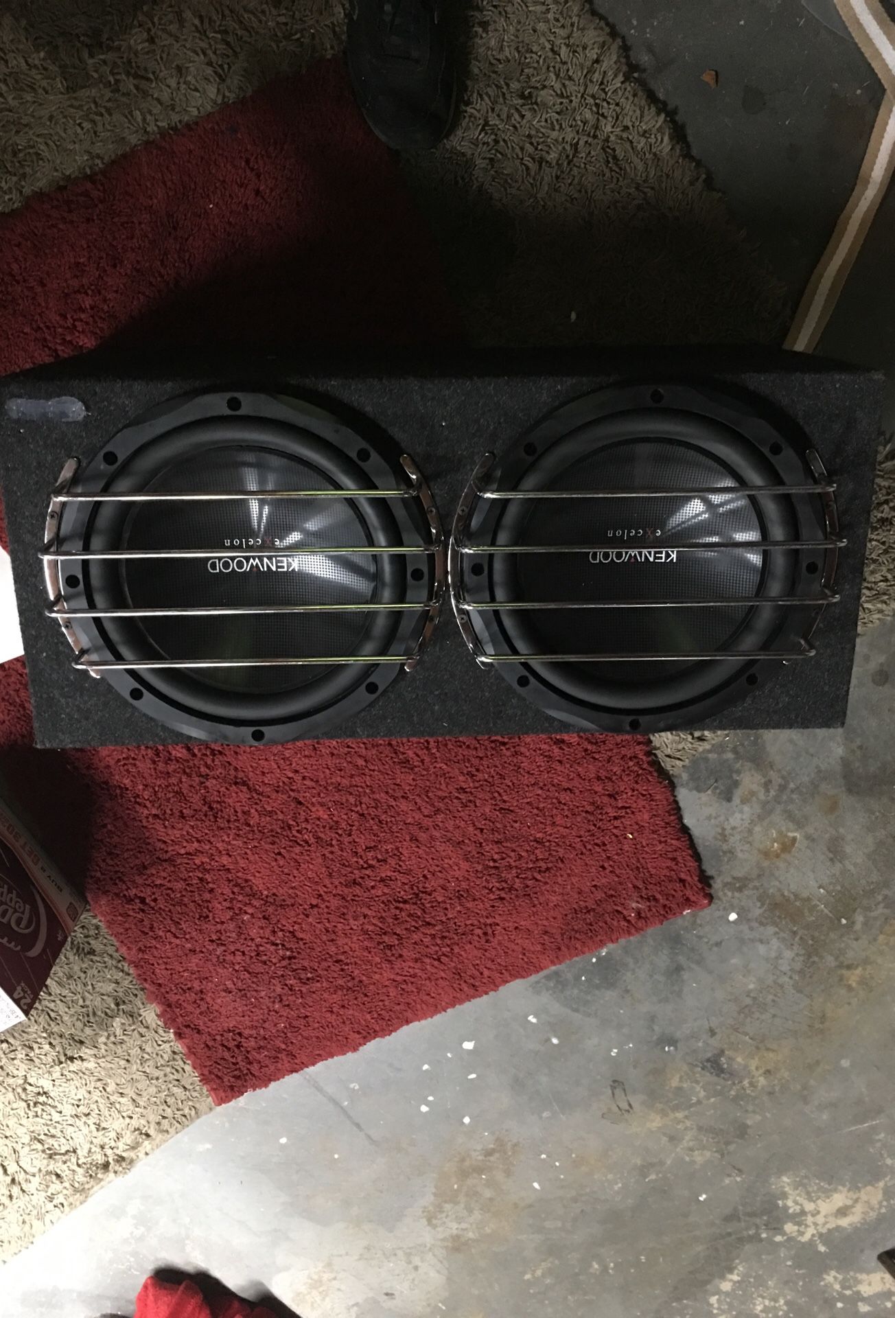To Kenwood 12 inch subwoofers in sealed box and Kenwood thousand watt class D mono power amplifier And a JL audio XD 404 channel amp and a audio cont