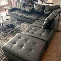 Heights Black Faux Leather Reversible Sectional with Storage Ottoman Happy Homes
