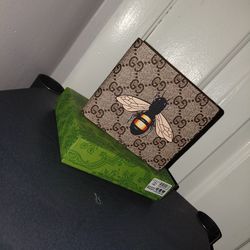 Brown and tan wallet with iconic logo