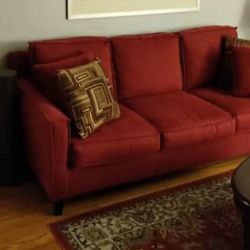 2 Sofas. From Bob's Furniture 1 Is Sleeper