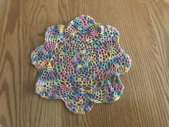 Vintage hand crocheted 8 pointed variegated pink doily 8”