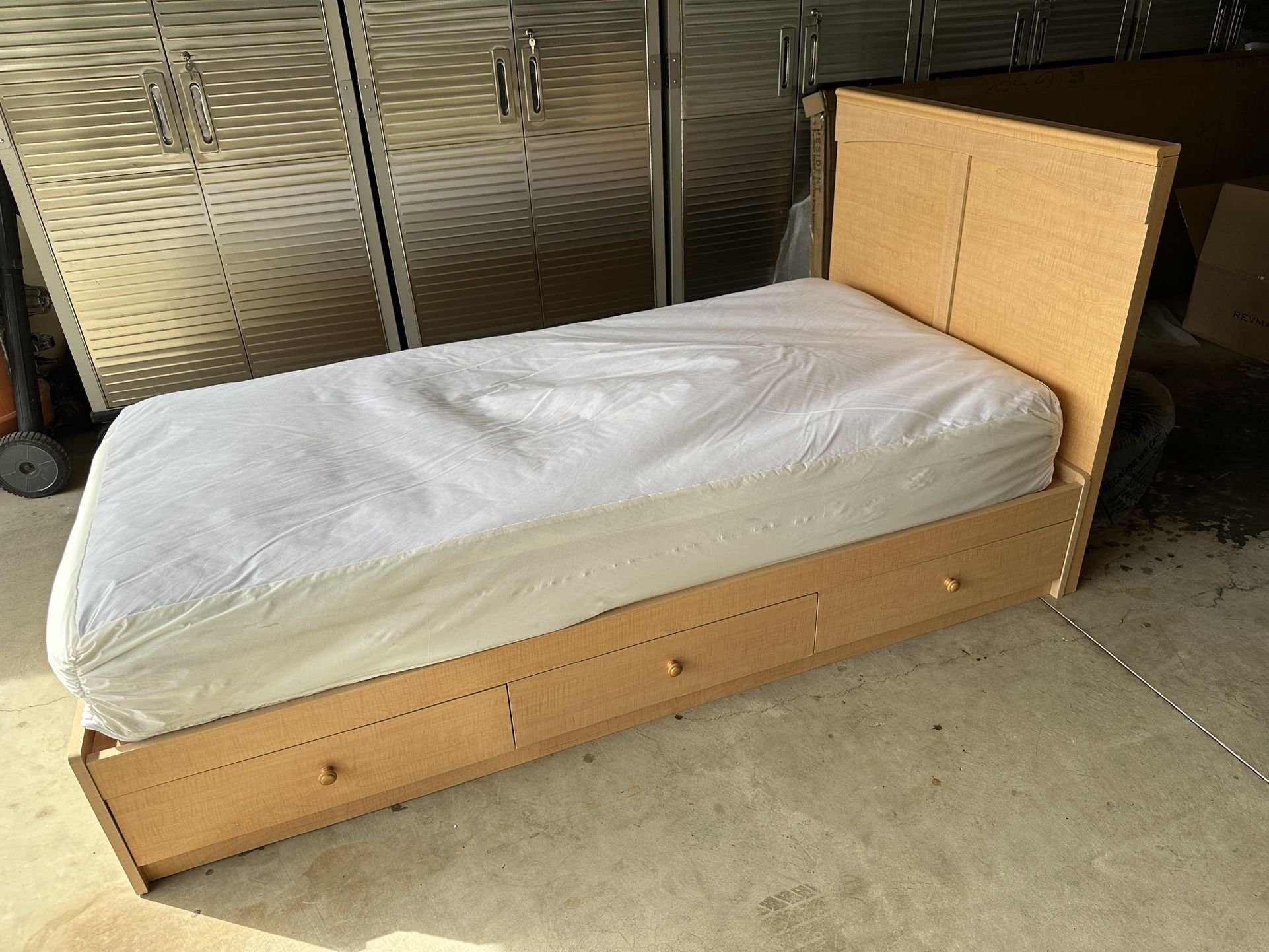 Twin bed frame with storage drawers and headboard and mattress with allerease cover in excellent condition.