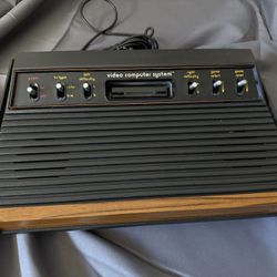 Atari 2600 console with joysticks, paddles and 16 games