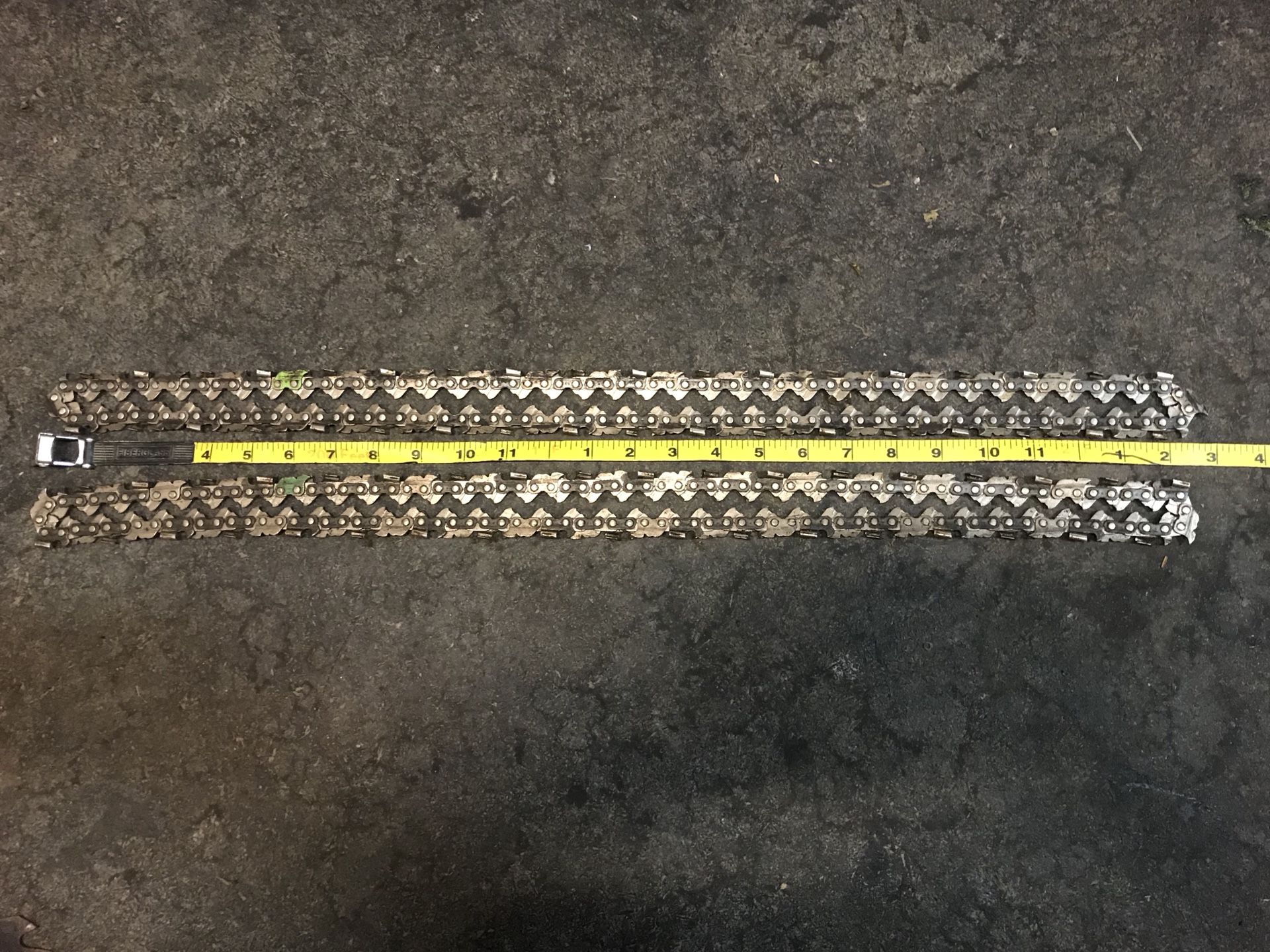 2 chainsaw chains and skillsaw blade.