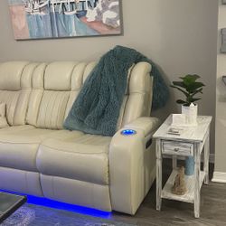 Ivory, White Real Leather Couch, And Loveseat With Electric Recliners, Dual On Both The Couch And Loveseat With Phone, Chargers, And in light lighting