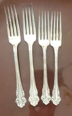 Four beautiful community silver triple plate forks