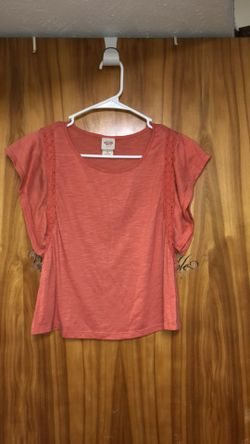 Kid’s size small flowy shirt with some crotchet at the beginning of the flared sleeves