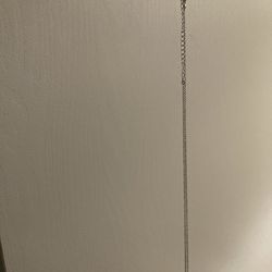 Designed with a white metal Necklace and small, square, transparent stones.very Beautiful 