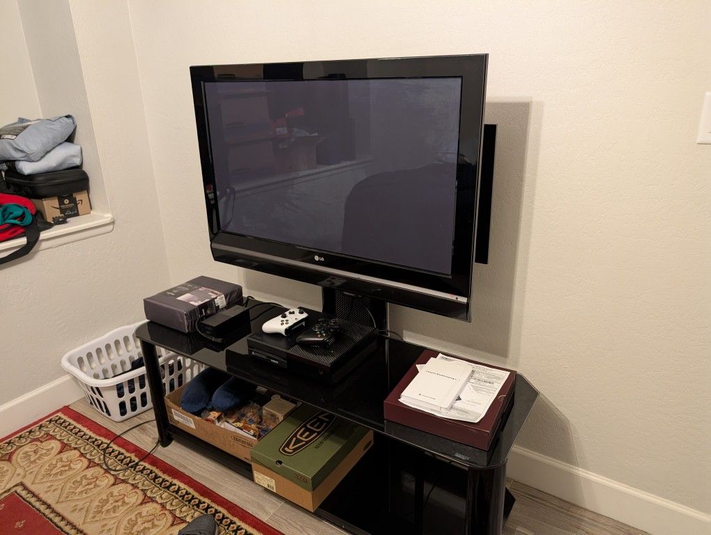 Used LG TV Connected To Entertainment Center 