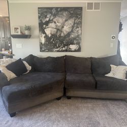 Living Spaces Dark Grey Cuddler Sectional Couch