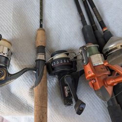 4  Fishing Poles And Reals 
