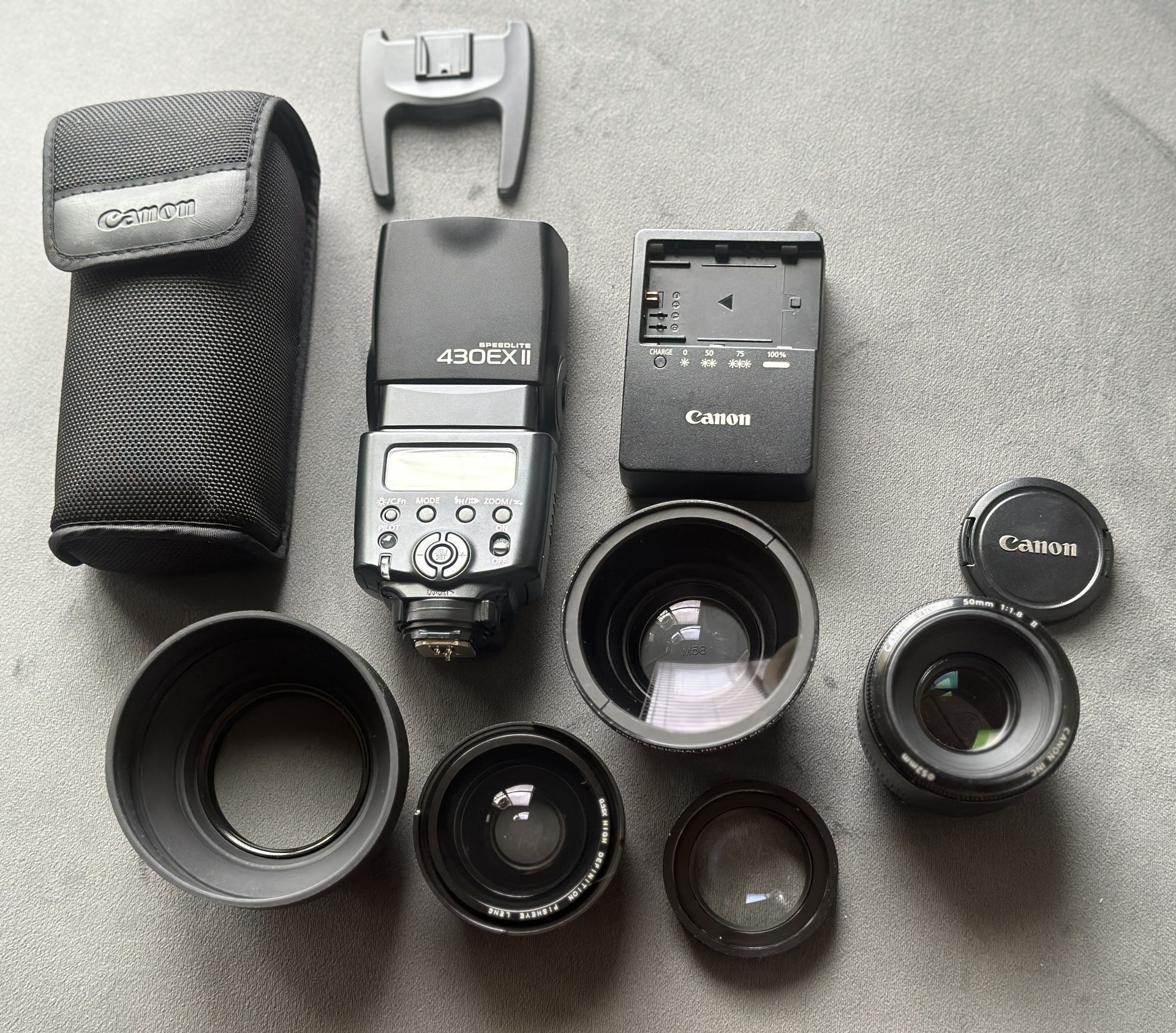 Canon FE 50mm Canon Speedlite 430EX II Canon LC- E6 Battery charger M58 Lens Filters LIKE NEW 