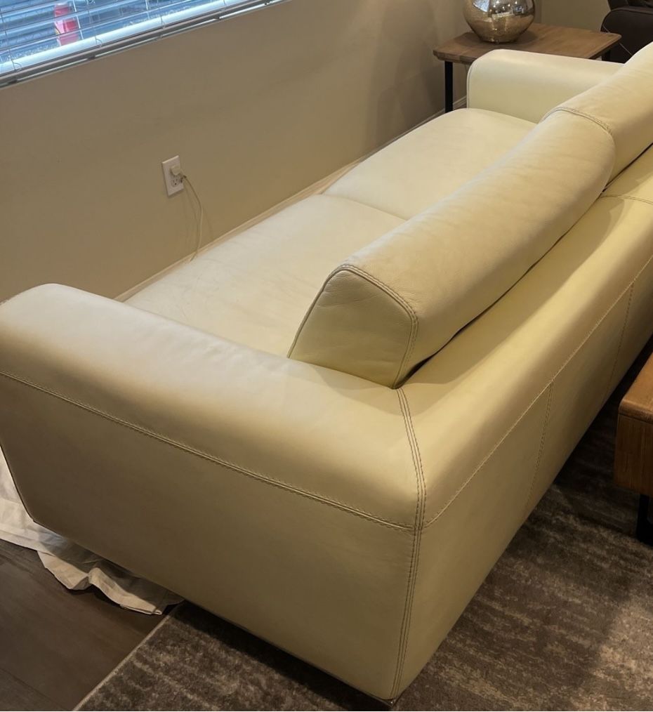 Used - Imported Mid Century Modern (Thick) Cream color Italian Leather Sofa, Chair and Ottoman.