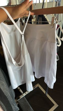 Sport wear skirt with shorts under and small size shirt