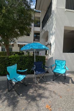 Beach chairs and umbrella